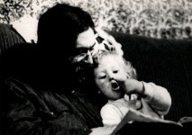 Eli & me, 1972, nose pointing reading a book on growing.jpg